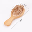 Brosse à cheveux ergonomique 19cm en bois naturel avec picots ronds pour un coiffage doux
