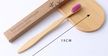 Brosse à dents bambou écologique Flowza avec poils mauves, design naturel durable et boîte en carton